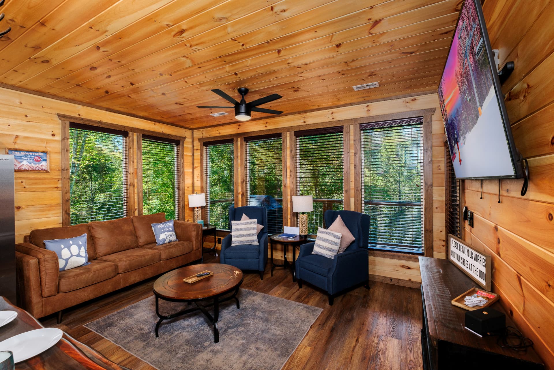 Cozy living room with wooded views